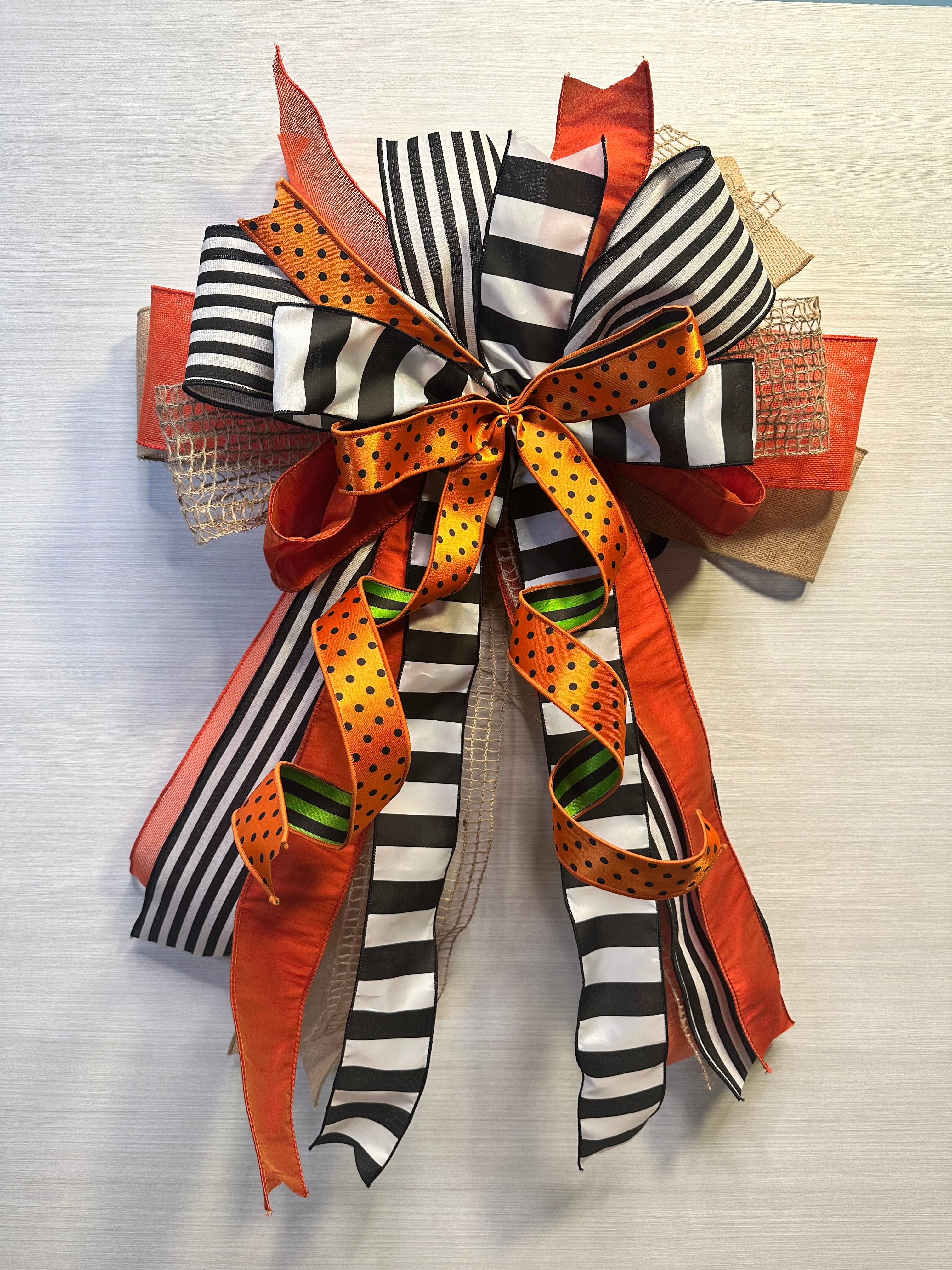 A Touch of Magic Luxury Oversized Door Bow | Orange, Black & White Halloween Statement Bow