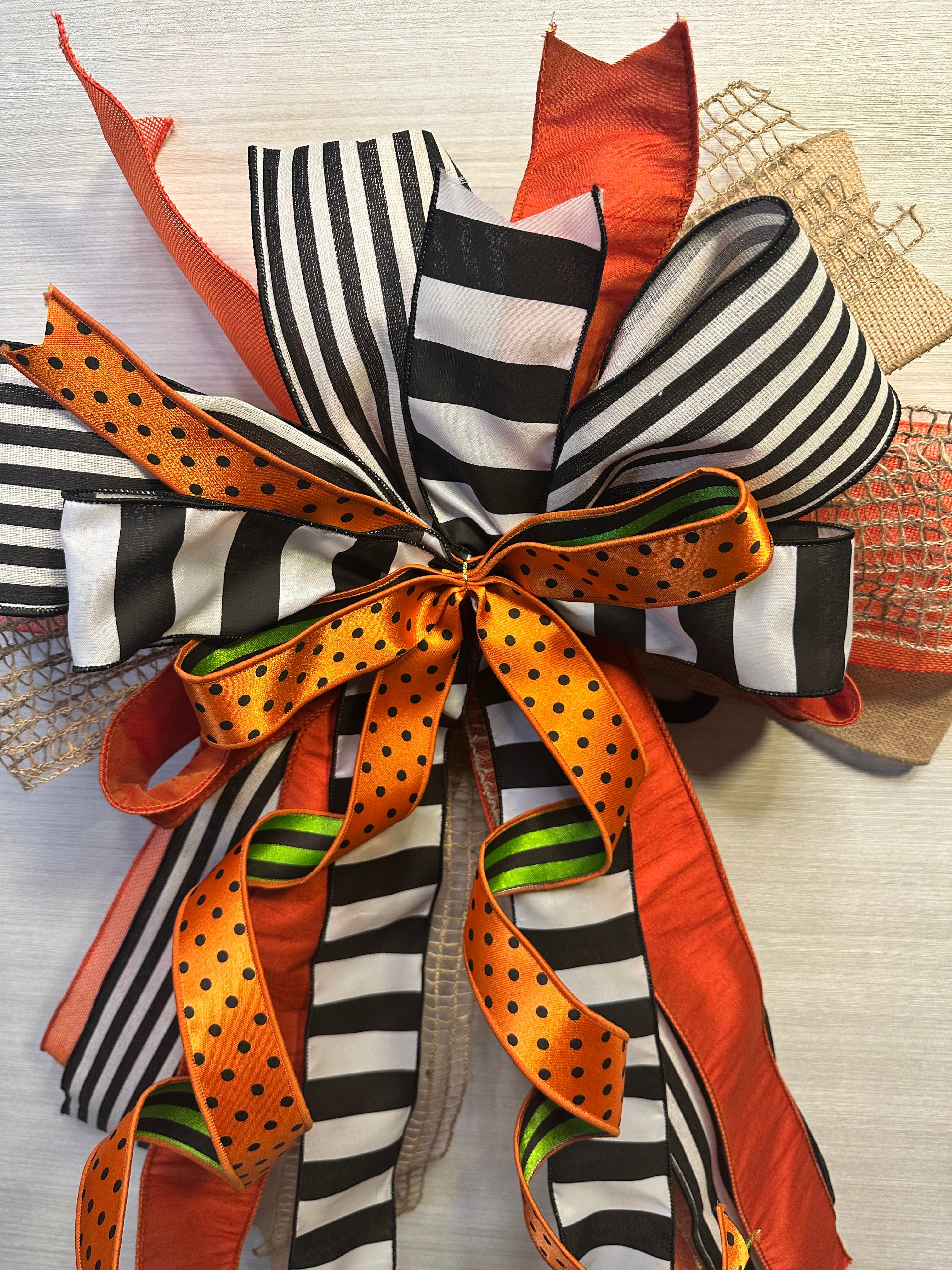 A Touch of Magic Luxury Oversized Door Bow | Orange, Black & White Halloween Statement Bow