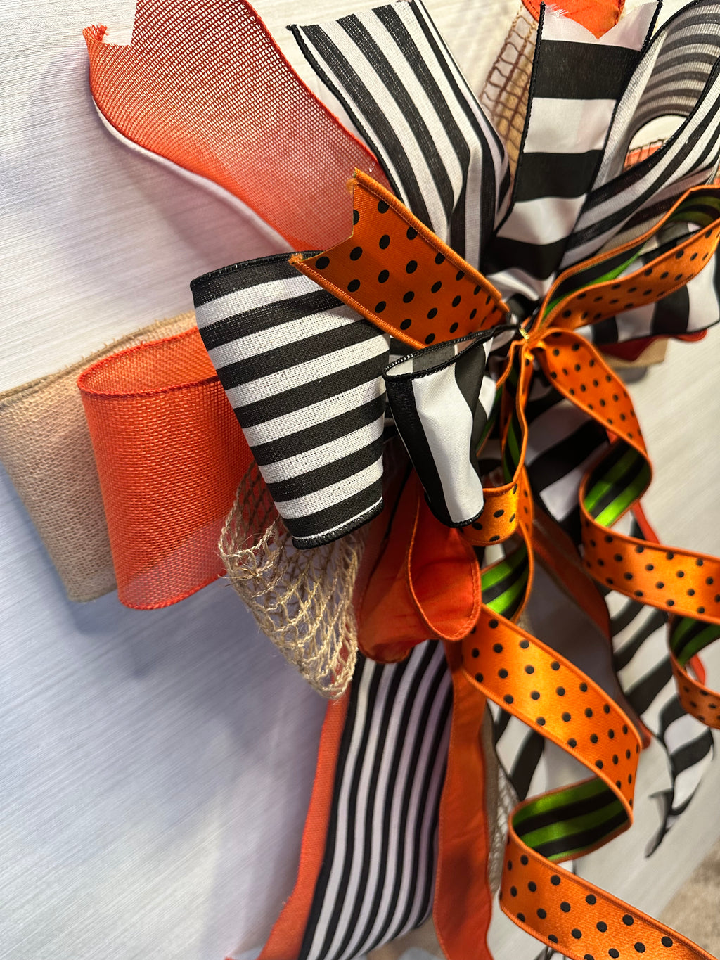 A Touch of Magic Luxury Oversized Door Bow | Orange, Black & White Halloween Statement Bow