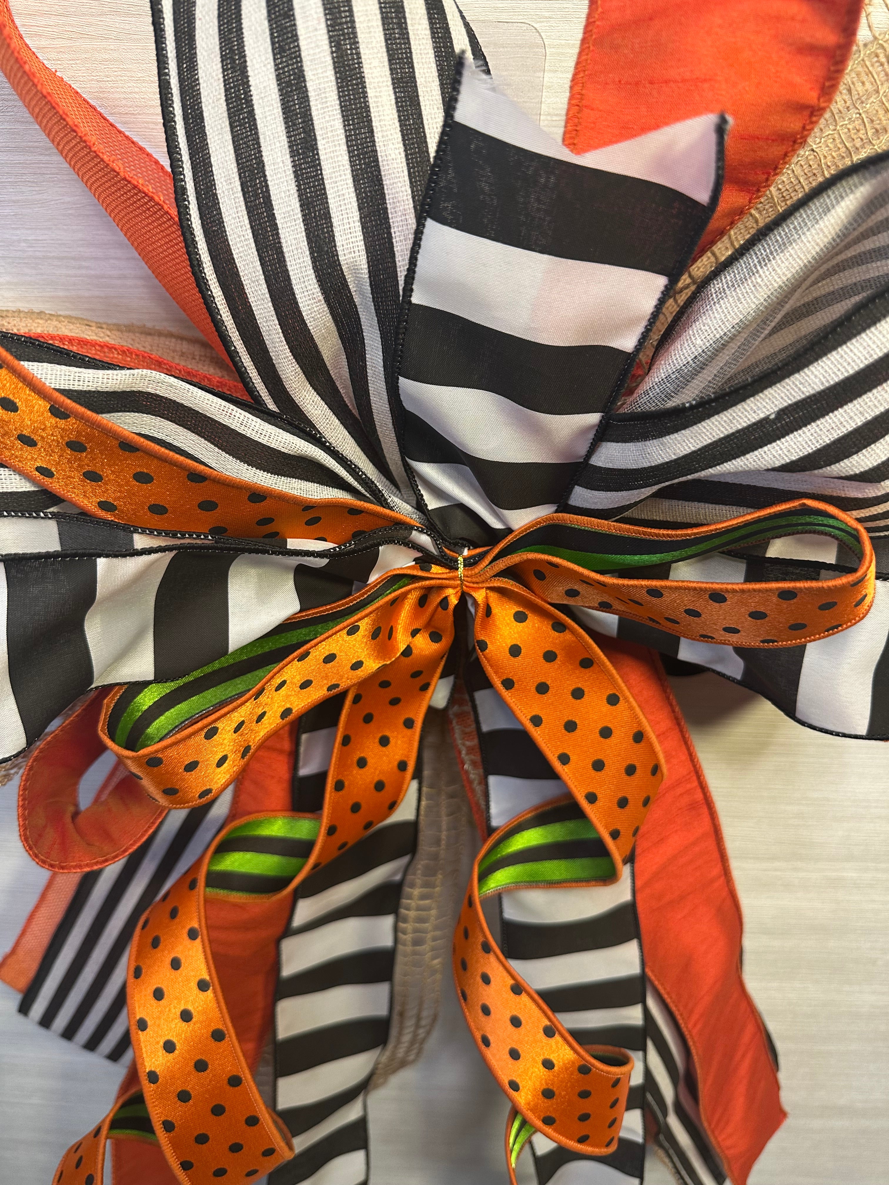 A Touch of Magic Luxury Oversized Door Bow | Orange, Black & White Halloween Statement Bow